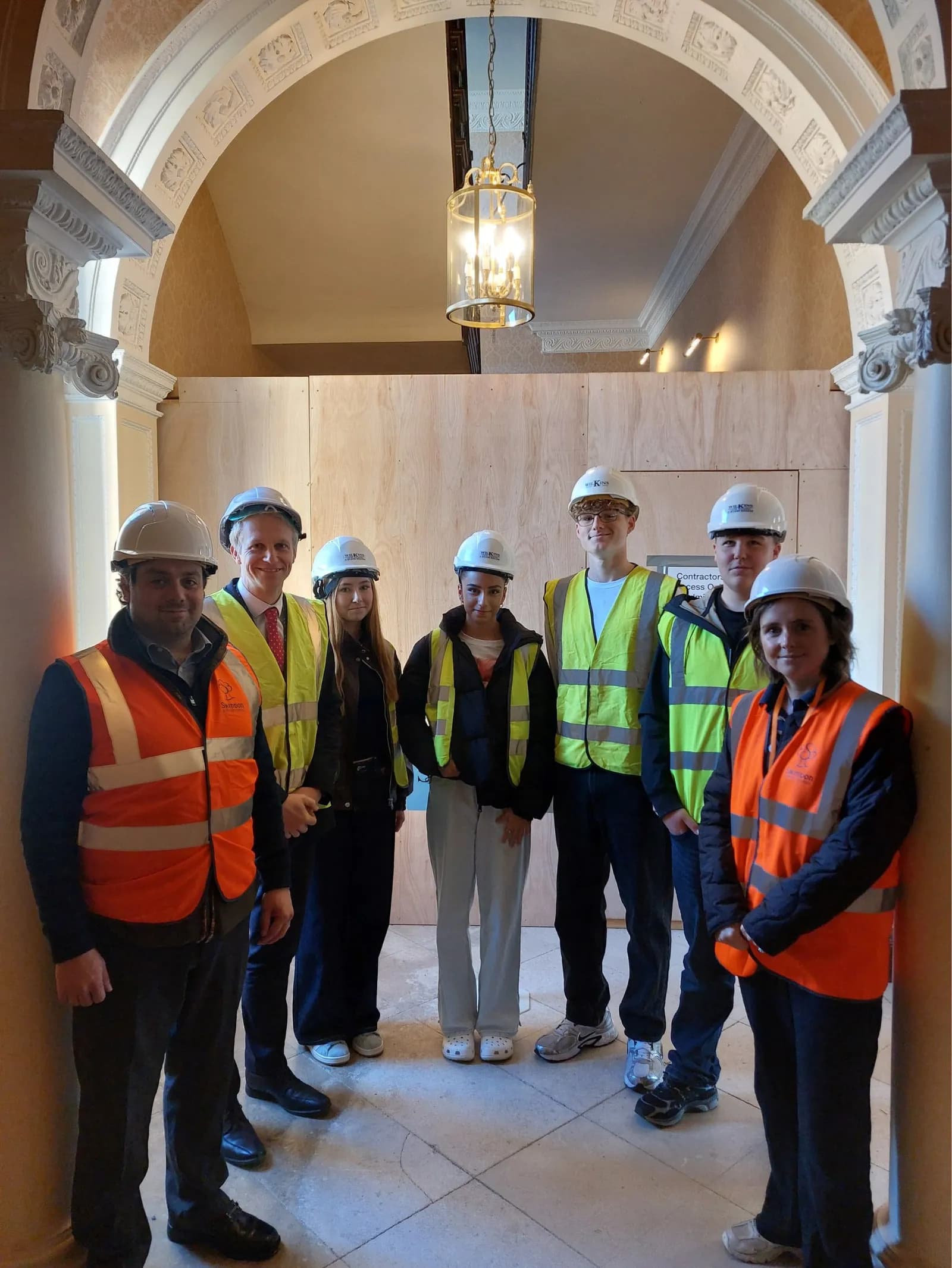 Cllr Courtliff, Joshua Coulson, Students and Cllr Tomlinson in front of the main stairway in Lydiard House.